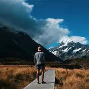 A man walking through a mountain range