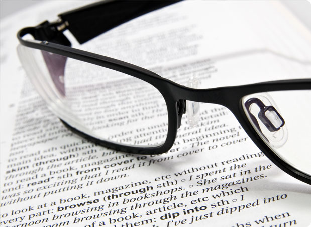 Reading glasses on text