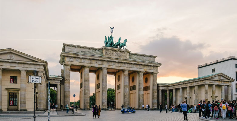 The Brandenburg Gate, which is located in Berlin, Germany, is a series of 5 archways with a statue of a carriage being pulled by 4 horses on top