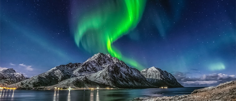 Picture of green Aurora Borealis (Nothern Lights) above a mountain